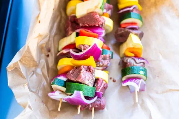 Raw Skewers Beef Fresh Veggies Wrapped Butcher Brown Paper Await — Stock Photo, Image