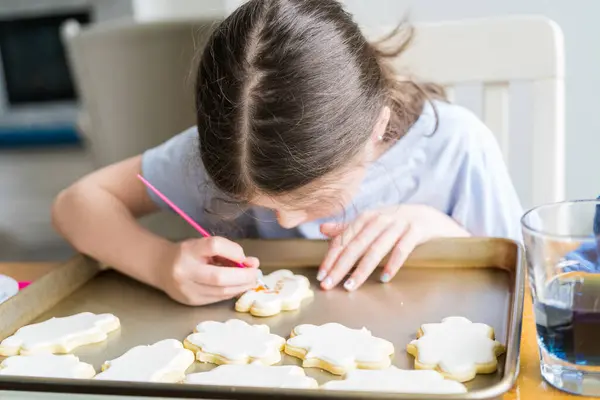 Heartwarming Scene Little Girl Carefully Writing Sorry Sugar Cookies Food — Stock Photo, Image