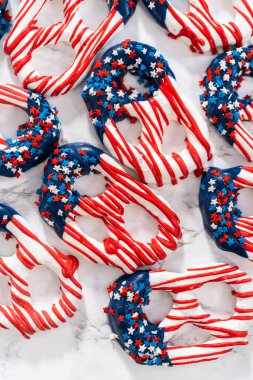 American flag. Red, white, and blue chocolate-covered pretzel twists.