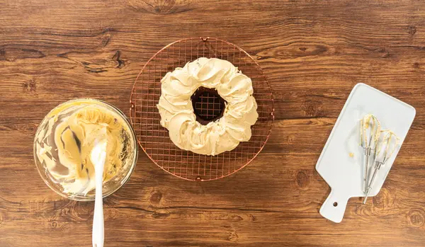Flat Lay Gingerbread Bundt Cake Being Generously Frosted Salted Caramel — Stock Photo, Image