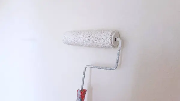 Partially Painted Wall White Paint Roller Showcasing Process Wall Renovation — Stock Photo, Image