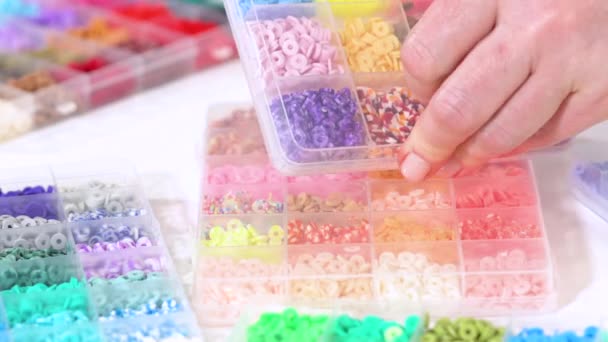 Hands Busily Selecting Vast Collection Brightly Colored Clay Beads Neatly — Stock Video