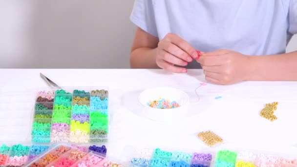 Young Girl Deeply Focused Art Bracelet Making Threading Vibrant Clay — Stock Video