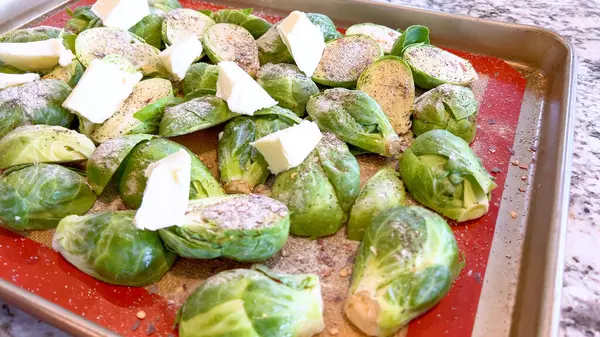 Fresh Brussels Sprouts Seasoned Spices Topped Slices Butter Arranged Baking – stockfoto