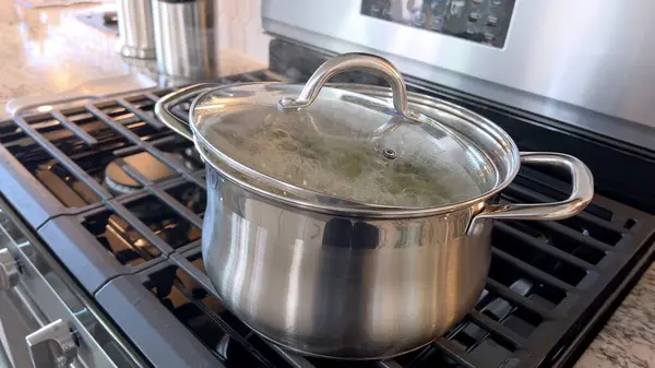 Captured Home Kitchen Image Features Stainless Steel Pot Boiling Water Stock Image