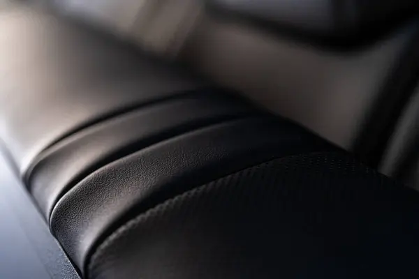 stock image Denver, Colorado, USA-May 5, 2024-This image showcases a close-up view of the back seats in a Tesla Cybertruck, highlighting the sleek leather design and meticulous craftsmanship that characterize