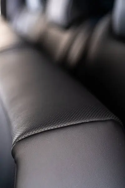 stock image Denver, Colorado, USA-May 5, 2024-This image showcases a close-up view of the back seats in a Tesla Cybertruck, highlighting the sleek leather design and meticulous craftsmanship that characterize