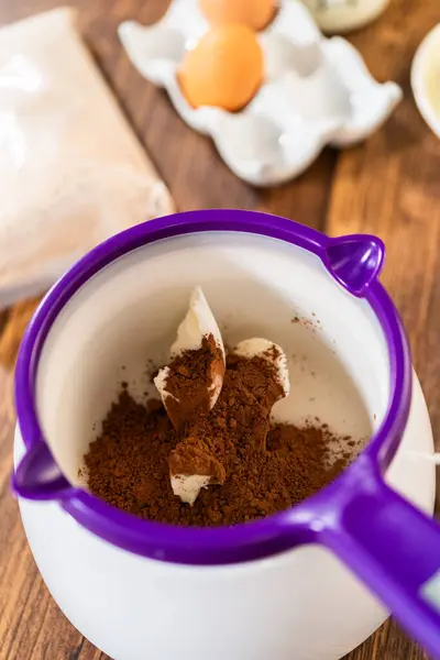 stock image Carefully greasing a bundt cake pan in preparation for baking a delicious gingerbread bundt cake with caramel frosting.