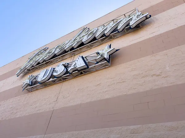 Stock image Colorado Springs, Colorado, USA-July 10, 2024-The Tinseltown USA theater sign prominently displayed on the exterior of the building against a clear blue sky. The sign features a classic, vintage-style