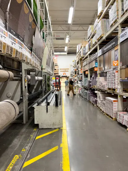 stock image Broomfield, Colorado, USA-August 24, 2024-A wide shot of a Home Depot store aisle, showcasing neatly arranged shelves stocked with home improvement products. The image captures signage for sections