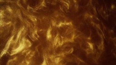 Parıldayan sıvı hareketi. Erimiş altın. Işıltılı sarı sıvı boya akışı.