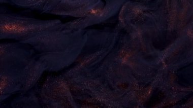 Soyut bronz boya. Siyah bir arkaplanda çekim yapmak.