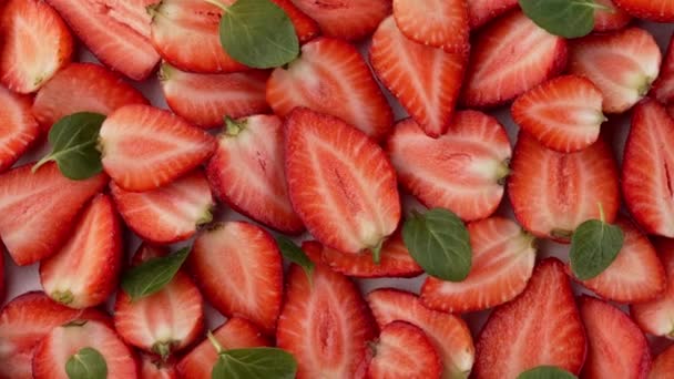 Halves Ripe Strawberries Fresh Mint Leaves Lie White Background — Stock Video
