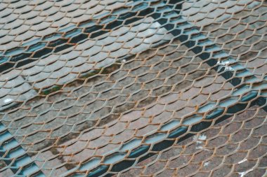 A detailed close-up of a metal mesh fence, showcasing the intricate patterns and structure of the fencing material. clipart