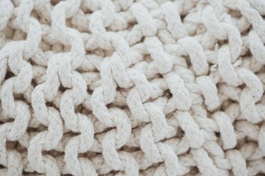 Çok yönlü kullanım için dokulu desenli yumuşak bej pamuk kumaş yakın plan.