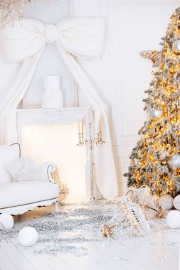 A cozy winter atmosphere features a decorated Christmas tree adorned with lights and ornaments. Nearby, gift boxes are placed thoughtfully, enhancing the festive spirit of the room. clipart