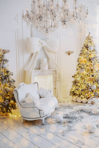 Cozy winter setting features a beautifully decorated Christmas tree, a stylish armchair, and a gift box awaiting discovery. The space is adorned with soft lighting, creating a warm ambiance.