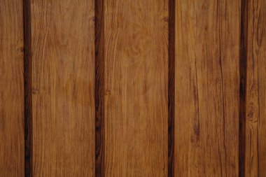 Yüzeyde zengin tanecikleri ve sıcak tonlarıyla karakterize edilmiş dikey ahşap tahtalar sergilenerek, kırsal ve rahat bir atmosfer yaratıyor. Yaratıcı projelerde veya ev dekoru bağlamında arkaplan için ideal.