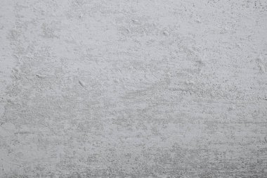 Pürüzsüz gri beton bir yüzey, çeşitli tasarım projeleri, sanatsal gösteriler veya mimari sergiler için uygun çok yönlü bir zemin sunan ince bir dokuyu sergiler. Basitlik ve modernliği vurguluyor.