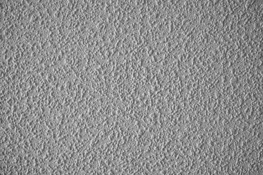 Gri desenli bir duvarın yakın plan görüntüsü karmaşık desenler ve detaylar.