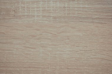 Doğal tahıl ve doku örneklerini gösteren açık ahşap bir yüzeye yakından bakın..