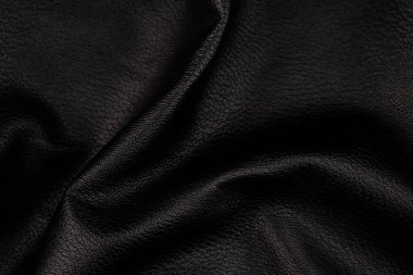 Siyah deri desenli sırt çantası. Deri bir zemin gibi