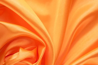 Pürüzsüz ve Parlak Bitirimli Lüks Turuncu Saten Kumaş. İpeksi arkaplan. 