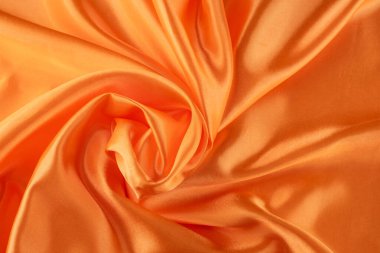 Pürüzsüz ve Parlak Bitirimli Lüks Turuncu Saten Kumaş. İpeksi arkaplan. 