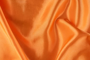 Pürüzsüz ve Parlak Bitirimli Lüks Turuncu Saten Kumaş. İpeksi arkaplan. 