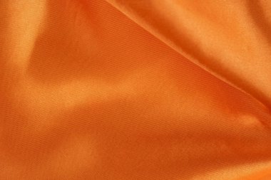 Pürüzsüz ve Parlak Bitirimli Lüks Turuncu Saten Kumaş. İpeksi arkaplan. 
