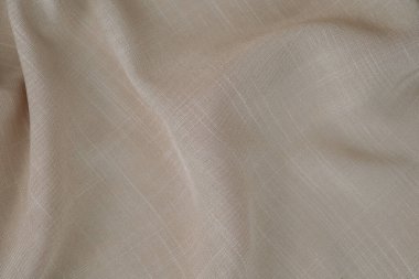 Katlanmış bej kumaş. Pamuk kumaş arka plan..