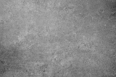 Doğal tahıl desenli, pürüzlü gri beton bir arka plan ve ince bir yüzey çatlağı.