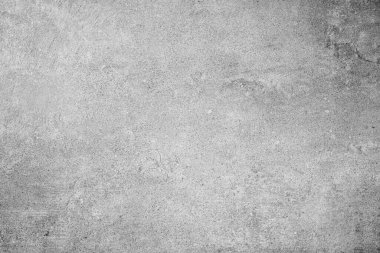 Hafif çizikler ve desenli arka planla açık gri beton duvar yüzeyi