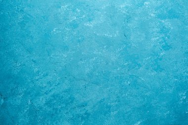 Kaba alçı desenli mavi duvar ve benekli grunge yüzeyi
