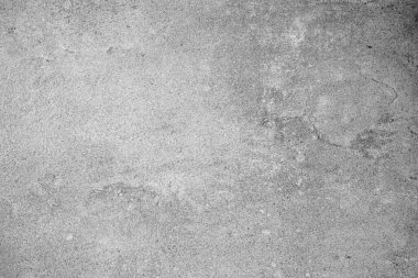 Hafif çizikler ve desenli arka planla açık gri beton duvar yüzeyi