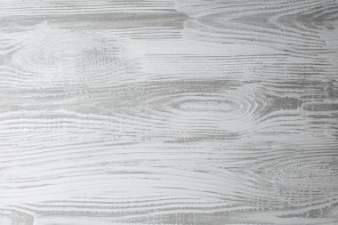 Eşsiz tahıl ve doku içeren beyaz ahşap bir yüzey görüntüsü.