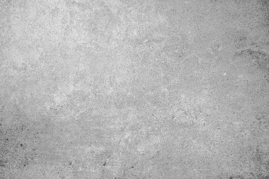 Hafif çizikler ve desenli arka planla açık gri beton duvar yüzeyi