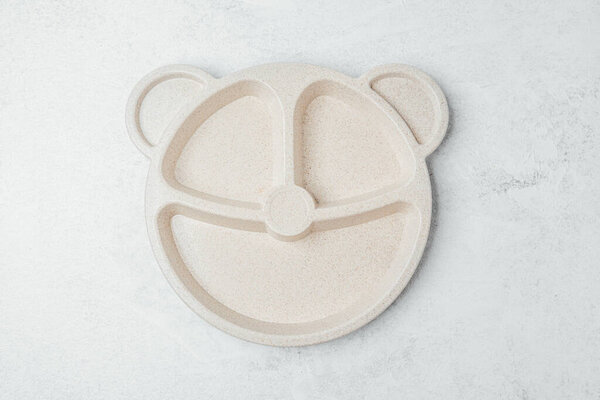 A bear-shaped plate designed for children to make mealtime more enjoyable.