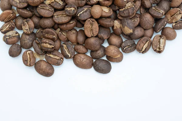 Light roasted coffee beans on isolated background. The flavour profile of light roasted will be quite acidic but youll also expect fruity notes and a more aromatic experience too.