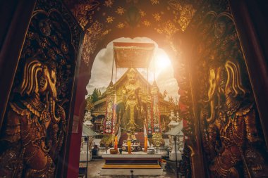 The entrance door of Wat Ming Muang the beautiful architecture of Lanna temple style in Chiang Rai province of Thailand.