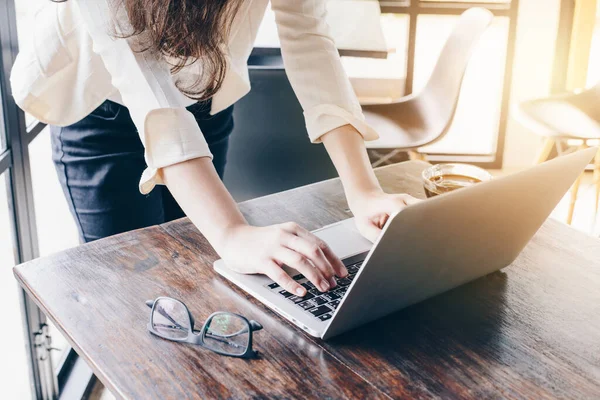 stock image Cropped shot view of businesswoman using her laptop in office.