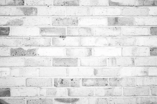 Full frame shot of white concrete wall textured and background. A concrete wall is a wall constructed of concrete blocks of uniform size.