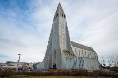 Reykjavik, Iceland - March 27 2016: Hallgrimskirkja an iconic church in Reykjavik the capital cities of Iceland. clipart