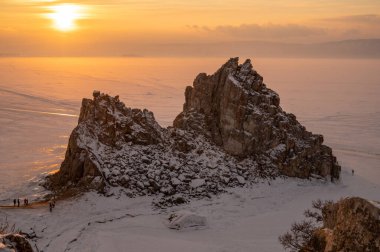 The Shaman rock one of sacred place in frozen lake Baikal in winter season of Siberia, Russia during sunse. This rock is a subject of many popular legends and myths about Baikal Lake and Angara river.