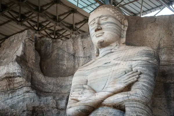 stock image Beautiful standing Buddha image depicts an unusual mudra is said to be the finest of the series at Gal Vihara in ancient city of Polonnaruwa, Sri Lanka.