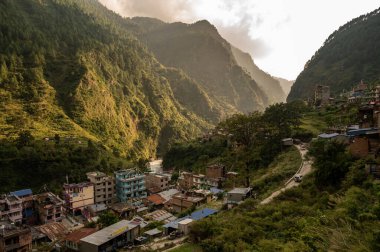 View of Syabrubesi village a beautiful resident village inside the Langtang National Park of Nepal. clipart