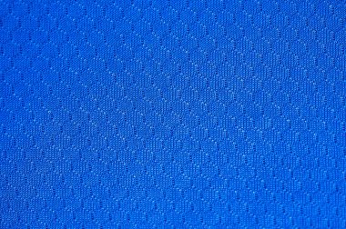 Mavi polyester kumaş dokusu ve arka planının tam kare görüntüsü. Bu kumaş dünyanın en popüler tekstil ürünlerinden biridir ve binlerce farklı tüketici ve endüstriyel uygulamalarda kullanılır..