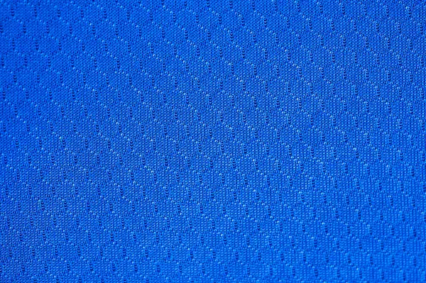 Mavi polyester kumaş dokusu ve arka planının tam kare görüntüsü. Bu kumaş dünyanın en popüler tekstil ürünlerinden biridir ve binlerce farklı tüketici ve endüstriyel uygulamalarda kullanılır..