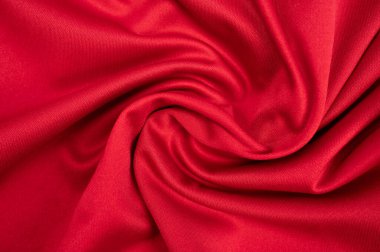 Kırışık kırmızı polyester kumaş dokusu ve arkaplan.