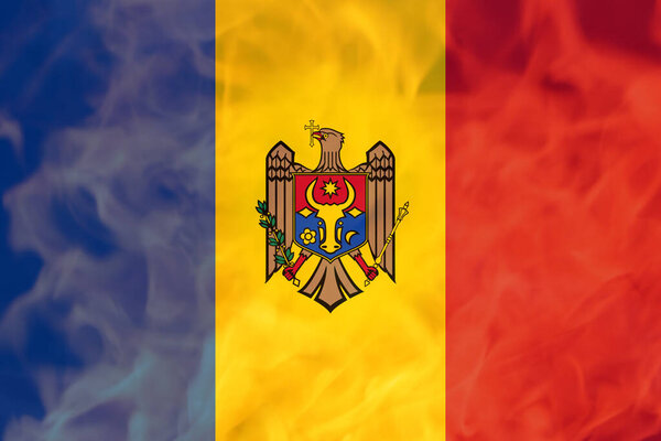Defocus protest in Moldova. Moldova flag painted on fire flame background. Strength, Power, Protest concept. Russia war. Out of focus.